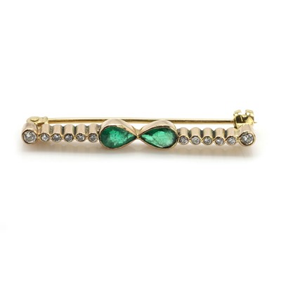 Lot 181 - An emerald and diamond bar brooch