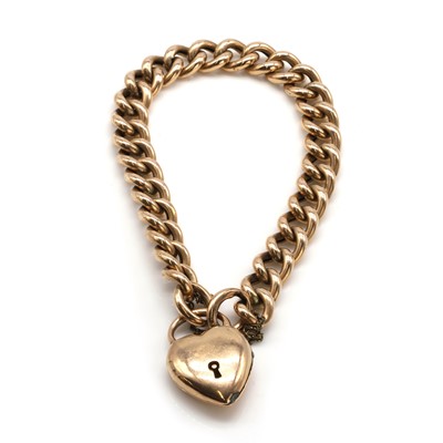 Lot 501 - A gold curb link bracelet