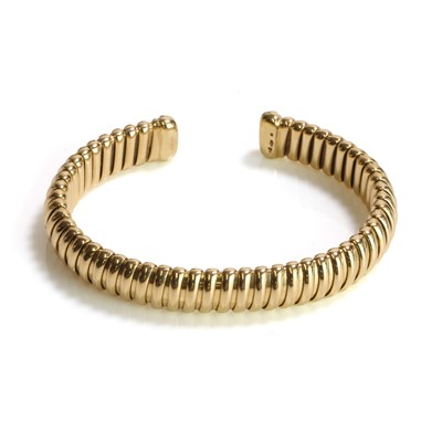 Lot 283 - An 18ct gold torque bangle, by Mappin & Webb