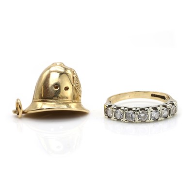 Lot 302 - A 9ct gold charm and a 9ct gold cubic zirconia ring