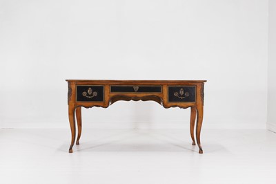 Lot 116 - A Louis XV-style provincial fruitwood, leather and ebonised bureau plat