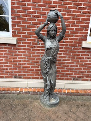 Lot 608 - A pair of figures of water carriers