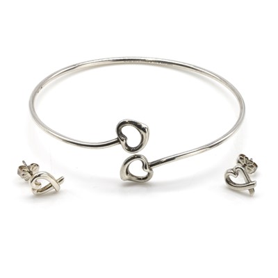 Lot 249 - A silver open heart bangle and a pair of earrings, by Tiffany & Co.