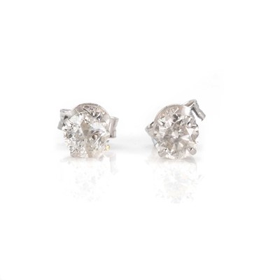Lot 79 - A pair of white gold diamond stud earrings