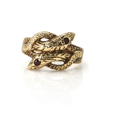 Lot 167 - A 9ct gold garnet set snake ring