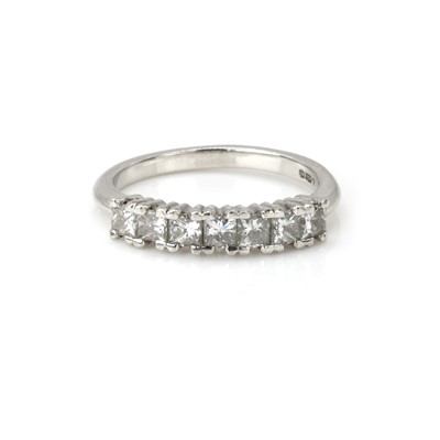 Lot 100 - A platinum and diamond half eternity ring