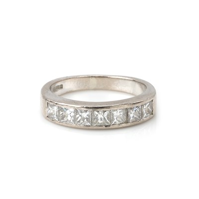 Lot 95 - An 18ct white gold diamond half eternity ring