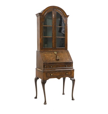 Lot 543 - A Queen Anne style figured and burr walnut bureau bookcase