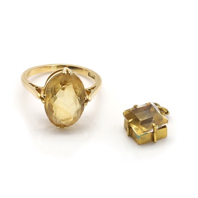 Lot 323 - A citrine ring and a gilt metal citrine pendant