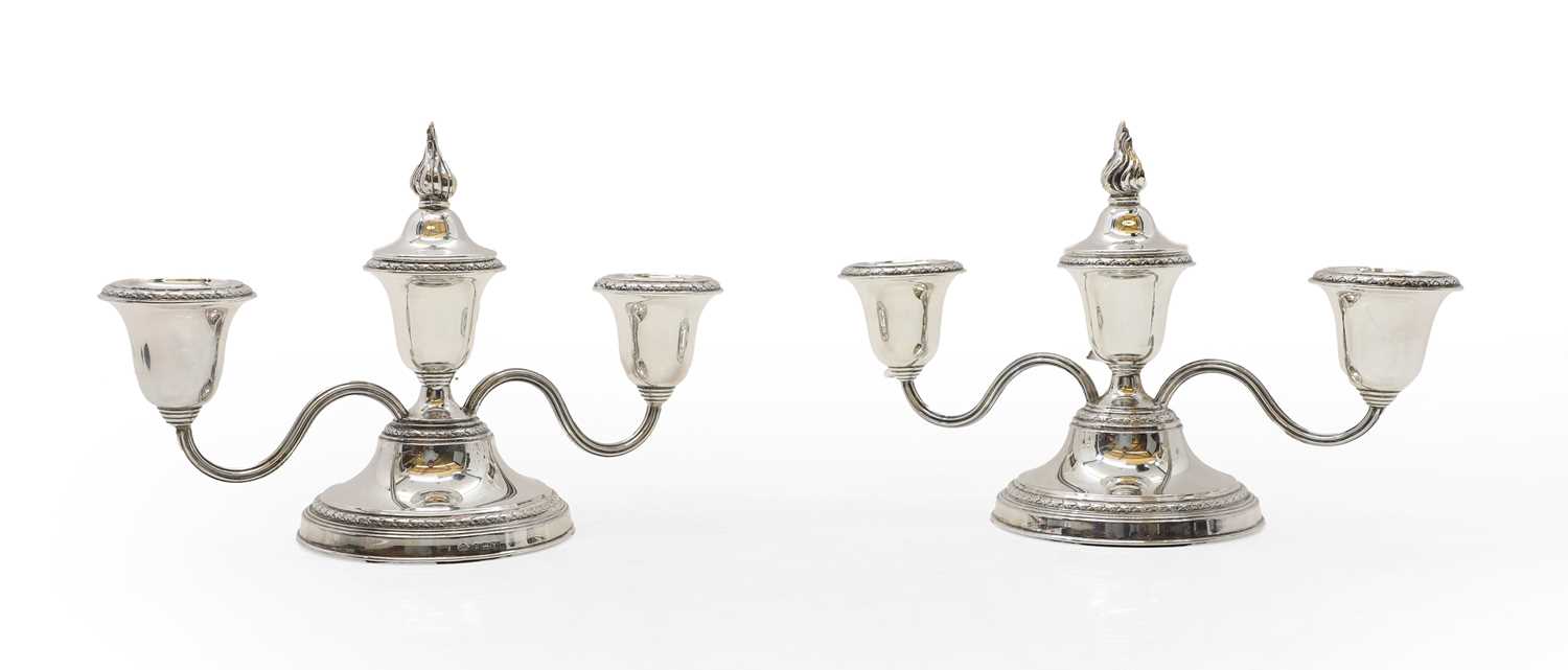 Lot 38 - A pair of silver dwarf candelabra