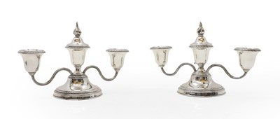 Lot 38 - A pair of silver dwarf candelabra