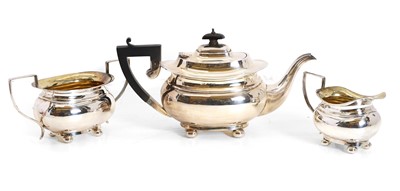 Lot 70 - A silver three piece tea set