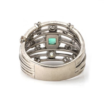 Lot 62 - An 18ct white gold emerald and diamond dress ring
