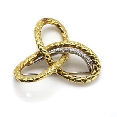Lot 109 - A gold diamond set knot brooch