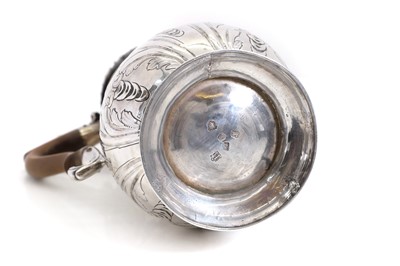 Lot 22 - A George II silver hot water jug
