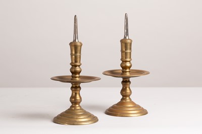Lot 76 - A pair of brass or bell-metal candlesticks