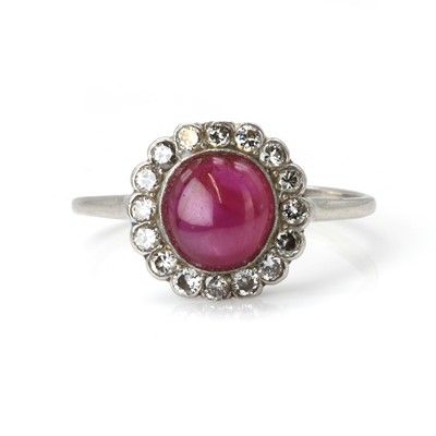 Lot 119 - A ruby and diamond cluster ring