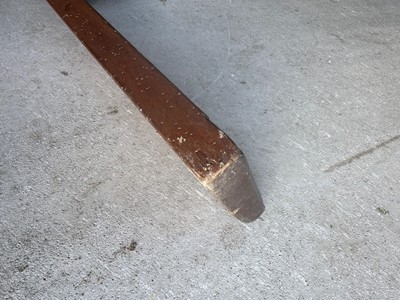 Lot 179 - A carved wood manglebraet