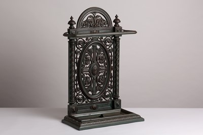 Lot 402 - A patinated cast iron stick stand