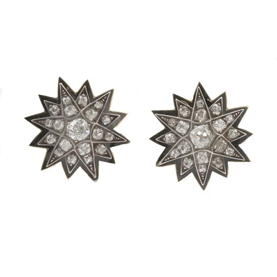 Lot 11 - A pair of diamond and enamel star earrings