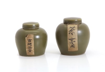 Lot 117 - A matched pair of Chinese 'teadust' glazed spice jars and covers