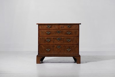 Lot 89 - A small figured walnut and feather-banded chest of drawers