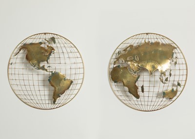 Lot A pair of brass and fret-cut wall-mounted 'world' sculptures