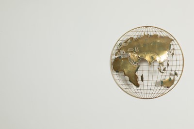 Lot 79 - A pair of brass and fret-cut wall-mounted 'world' sculptures