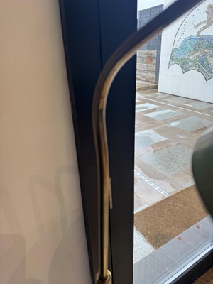 Lot 64 - A brass and green-lacquered standard lamp