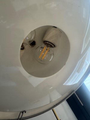 Lot 64 - A brass and green-lacquered standard lamp