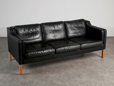Lot 88 - A black leather three-seater settee