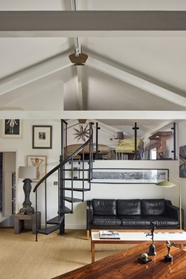 Lot 88 - A black leather three-seater settee