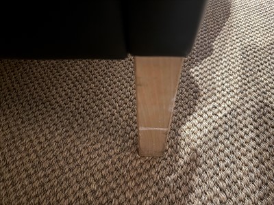 Lot 88 - A black leather three-seater settee