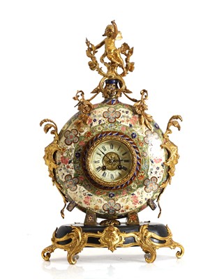 Lot 271 - A gilt metal mounted pottery mantel clock
