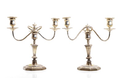 Lot 34 - A pair of silver candelabra