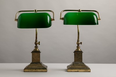 Lot 195 - A pair of brass and cased-glass desk lamps
