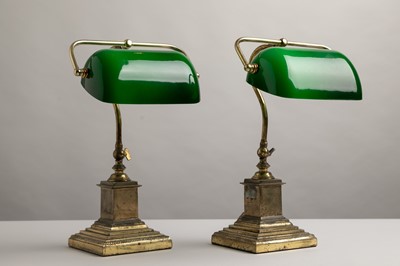 Lot 195 - A pair of brass and cased-glass desk lamps