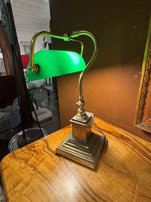 Lot 195 - A pair of brass and cased-glass desk lamps