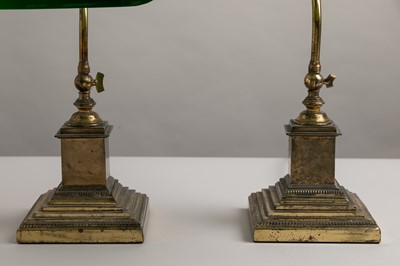 Lot 195 - A pair of brass and cased-glass desk lamps