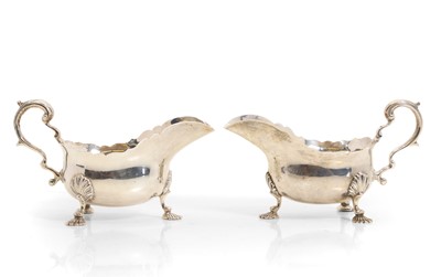 Lot 32 - A pair of George II style silver sauceboats