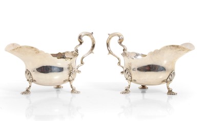Lot 32 - A pair of George II style silver sauceboats