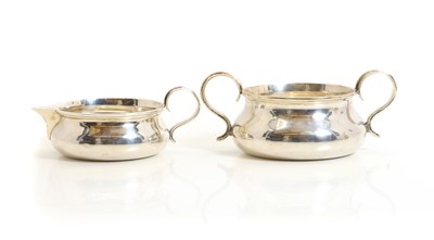 Lot 78 - An Edwardian silver cream jug and sugar bowl