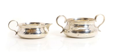 Lot 78 - An Edwardian silver cream jug and sugar bowl
