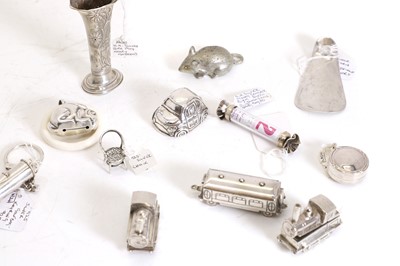 Lot 59 - A silver rabbit form teething ring with a white celluloid ring