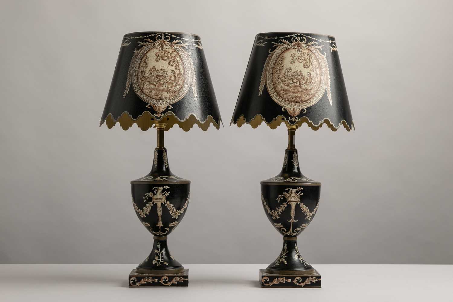 Lot 94 - A pair of painted toleware table lamps