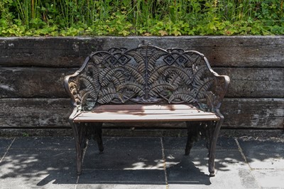 Lot 457 - A cast iron two-seater bench
