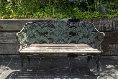 Lot 451 - A cast iron garden bench