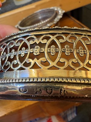 Lot 42 - A set of four George III silver wine coasters