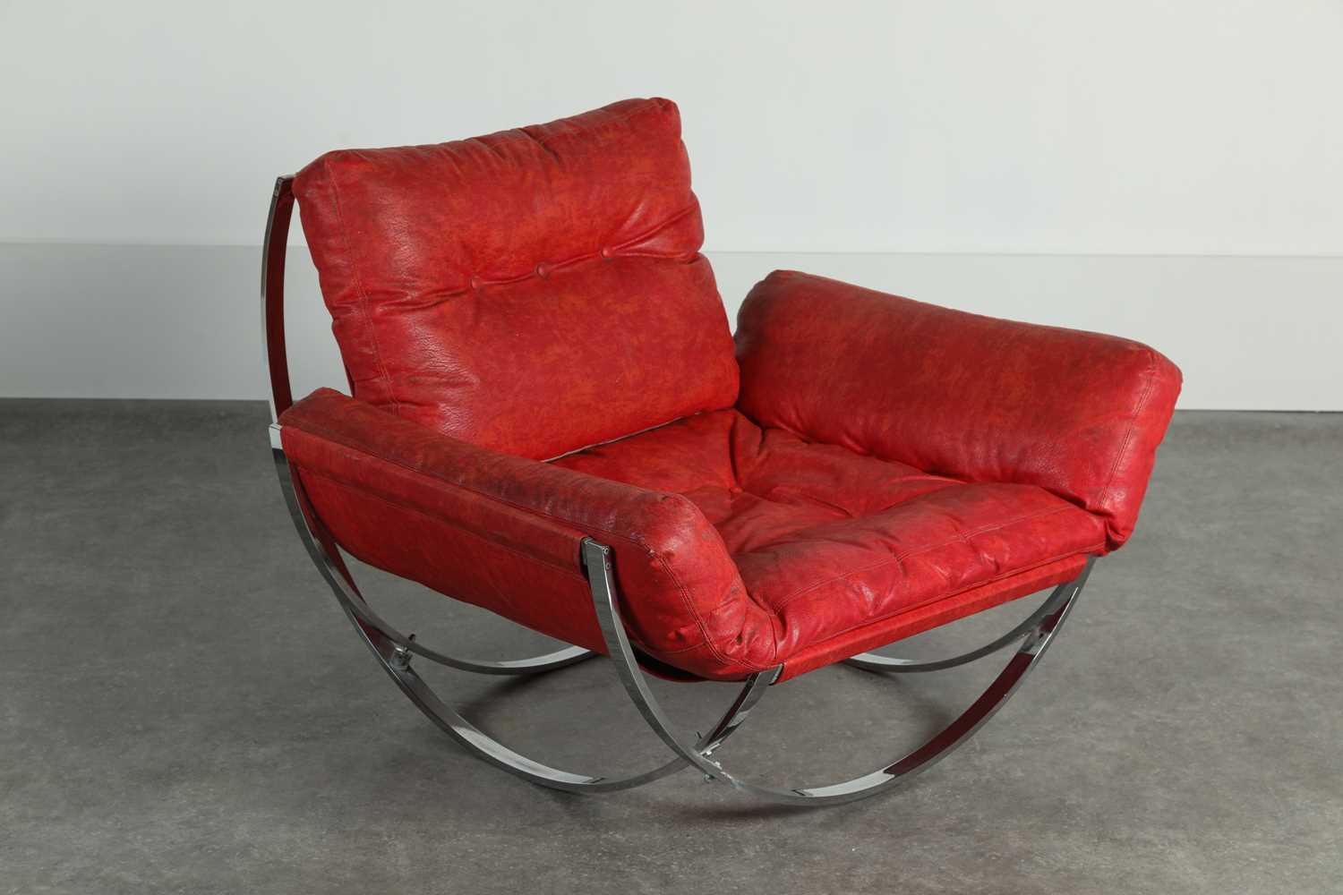 Lot 15 - A red leather and chrome 'Apollo' steel armchair