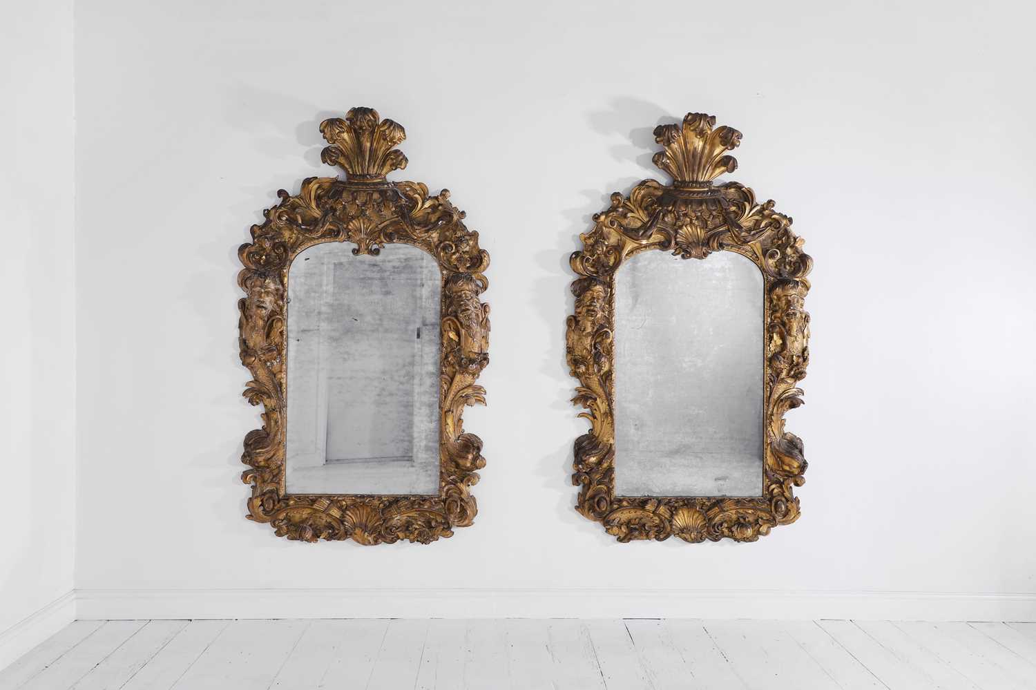 Lot 121 - A pair of George II giltwood pier mirrors attributed to Matthias Lock